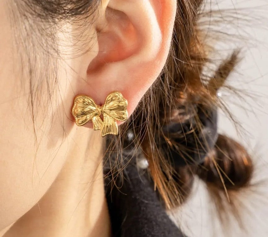Gold plated ribbon bow stud earrings